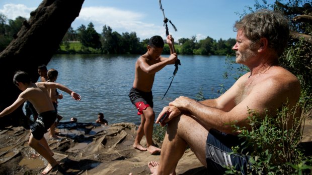 "Natural beauty and activities": Rod Robinson watches his son playing at the Nepean River. 