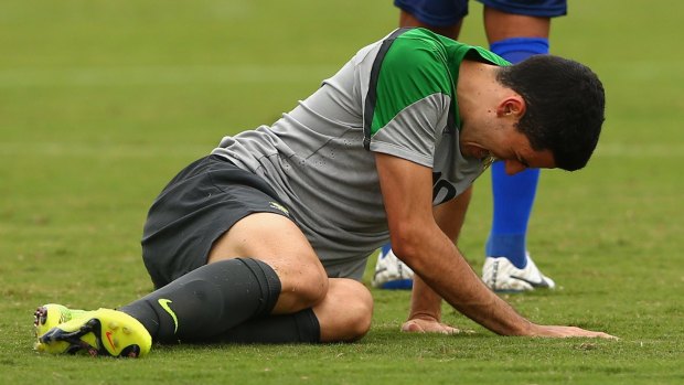 Tom Rogic goes down injured in the build-up to the 2014 World Cup in Brazil.