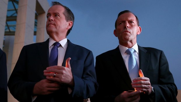 Opposition Leader Bill Shorten and Prime Minister Tony Abbott during a candlelight vigil for Andrew Chan and Myuran Sukumaran at Parliament House on Thursday. 
