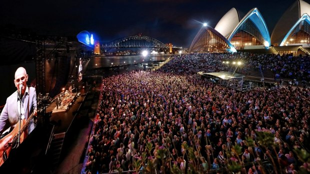 Paul Kelly plays to a rapt crowd on the Opera House forecourt.