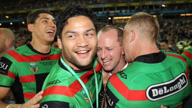 Suspended player Isaac Luke celebrates with the Rabbitohs after their grand final victory.