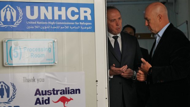 Andrew Harper gives Peter Dutton a tour of the UNHCR registration centre in Amman