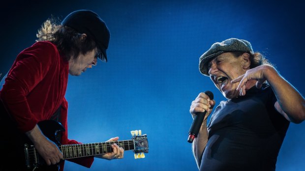 Guitarist Angus Young and Singer Brian Johnson  of AC/DC perform on stage during the legendary Australian rock band's 'Rock or Bust' World Tour at Etihad Stadium in Melbourne.
