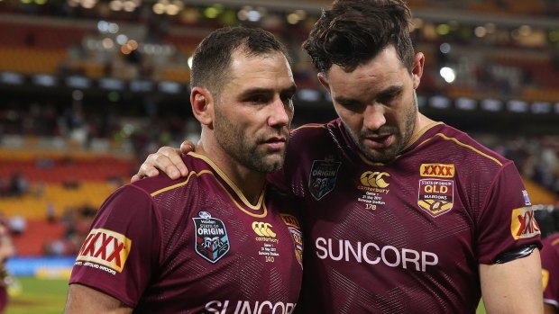 Tough night: Cameron Smith and Aidan Guerra look disconsolate after Queensland's humbling night.