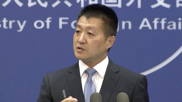 Lu Kang, spokesman of the Chinese Ministry of Foreign Affairs, speaks to reporters about the international tribunal's ruling on the South China Sea during a news briefing in Beijing.