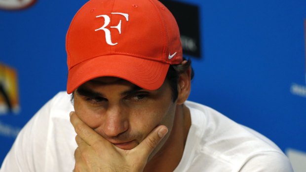 Out, not over: Roger Federer looks glum during post-match press conference.