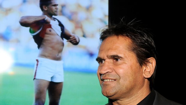 Passionate: Nicky Winmar at the launch of the AFL Indigenous Round in 2013. In the background is the famous picture of him taking a stand against racism. 
