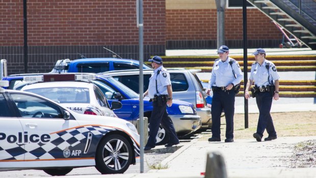 ACT police outside Canberra's Lanyon High School on Tuesday after a bomb threat.