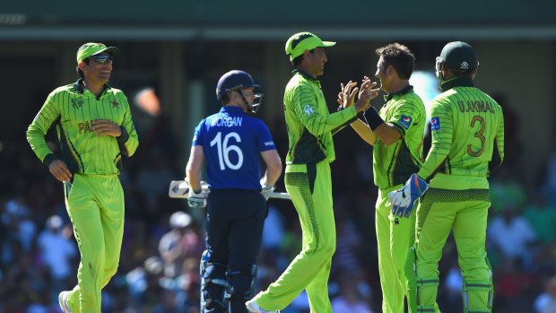 Walk of shame: England captain Eoin Morgan leaves the field on Wednesday as Pakistan celebrate.