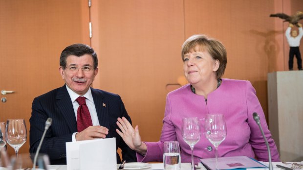 Turkish Prime Minister Ahmet Davutoglu and German Chancellor Angela Merkel at talks in Berlin on Friday. Europe wants Turkey's help to stem the flow of refugees and migrants seeking asylum in Europe.