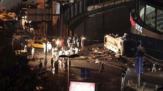 Police forensic officers at work following explosions near the Vodafone Arena, the home of the Besiktas football club in Istanbul. 