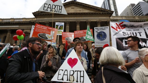 Demonstrators gather at the State Library to demand strong action on climate change.