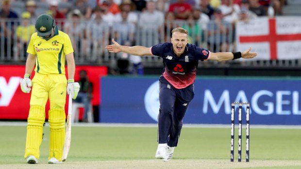 Full flight: England paceman Tom Curran celebrates after claiming the wicket of Australia's Adam Zampa.