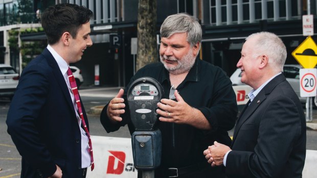 Labor's Michael Pettersson, parking operations manager Richard Siddall, , and acting urban services minister Mick Gentleman.