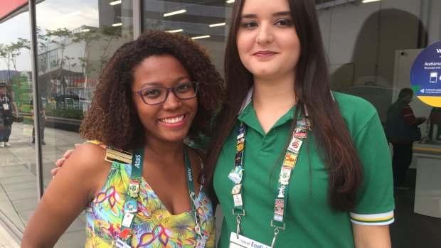 Daniele Martoreli, right, and Renata da Silva are working at the Rio Olympics and collecting pins for the first time for fun.
