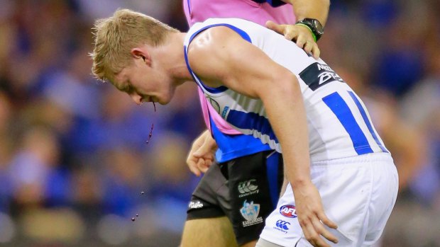 Jack Ziebell is helped from the ground.