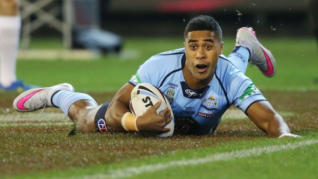 Lucky escape:  Michael Jennings celebrates scoring a try during game two of the Origin series.