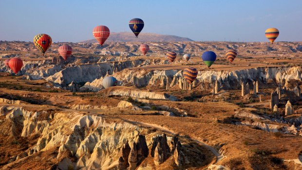 Hot air balloon flight above the spectacular landscape of Cappadocia, Turkey.