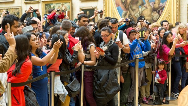 Paparazzi at the Louvre.