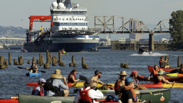 Activist kayakers wait as theThe Royal Dutch Shell PLC icebreaker Fennica heads up the Willamette River on Thursday. 