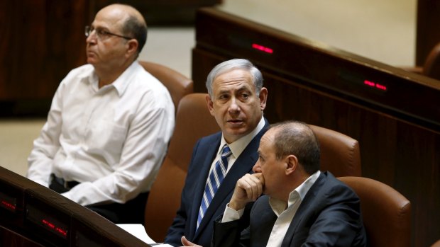 Mr Netanyahu centre, flanked by Defence Minister Moshe Yaalon (left) and Energy Minister Silvan Shalom.