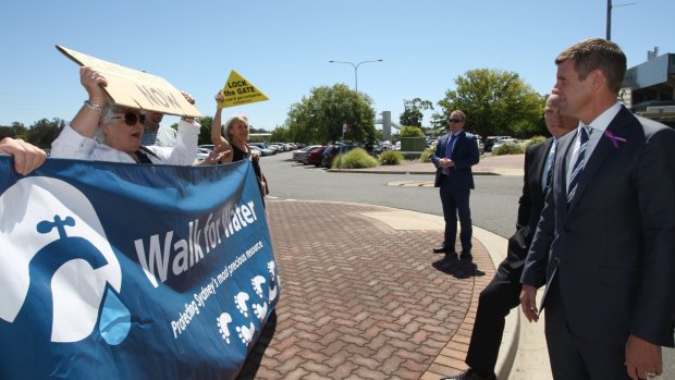 Premier Mike Baird faces off with coal seam gas protesters.