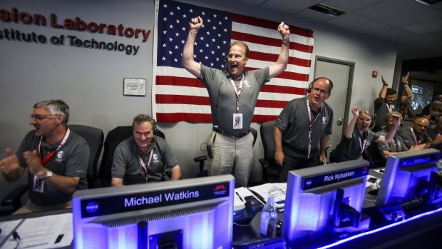 Mission Control at NASA's Jet Propulsion Laboratory celebrate as the solar-powered Juno spacecraft goes into orbit around Jupiter.