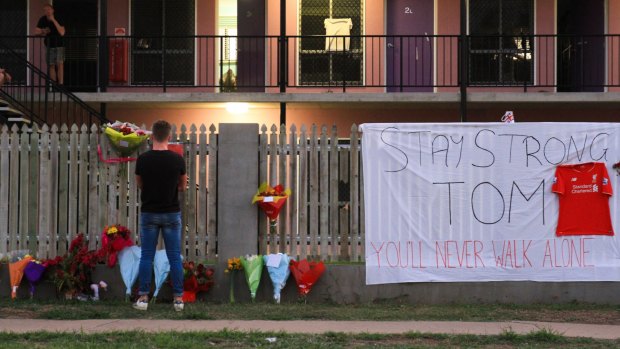 Tributes to victims Mia Ayliffe-Chung and Thomas Jackson were set up out front of the backpackers hostel.