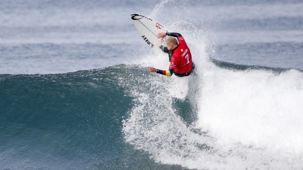 Snap happy: Mick Fanning advanced to round three after winning his heat in 4-5 foot (1.5 metres) waves at Winkipop.
