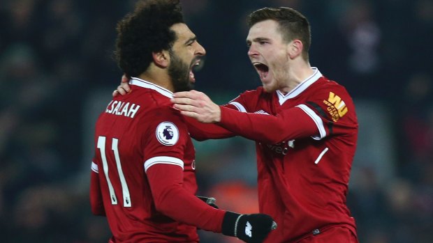 Liverpool's Andrew Robertson (right) celebrates with Mohamed Salah after Salah scored his side's fourth goal.
