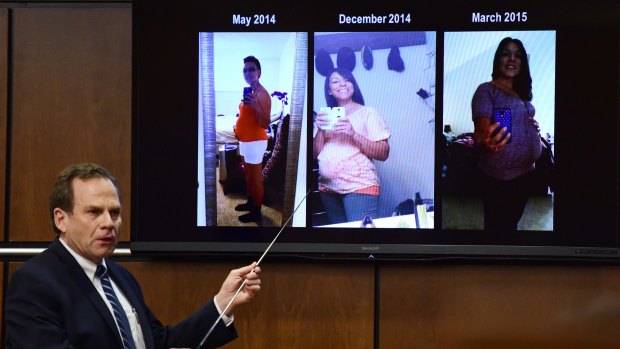 District Attorney Stan Garnett shows pictures of the defendant, Dynel Lane, accused of cutting a stranger's unborn baby from her womb, pretending to be pregnant on a screen in a Boulder District courtroom.