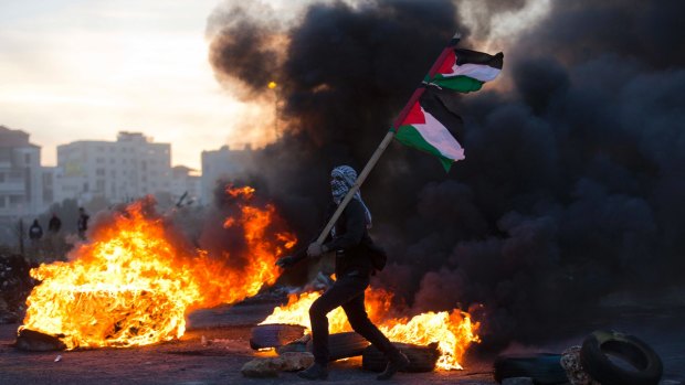 A Palestinian protester clashes with Israeli troops during protests against US President Donald Trump's decision to recognise Jerusalem as the capital of Israel.