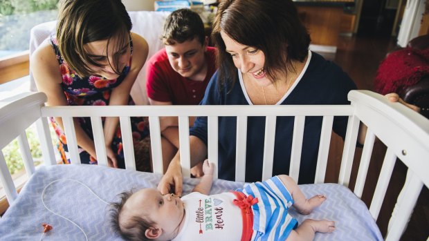 Three-month-old Charlie Clode with his family, Melissa, Lily (12), and William (14), at home in Bruce. 