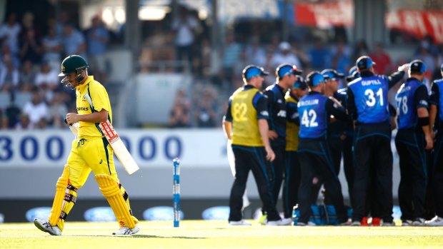 David Warner walks off the field after being given out lbw, sparking a batting collapse.