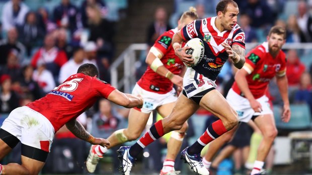 Old-fashioned carve up: Blake Ferguson breaks through the Dragons defence.