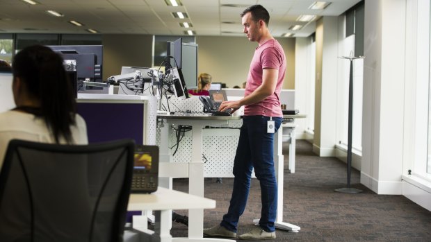 PwC consultant Tom Simmonds is one many office workers now embracing stand up desks for health benefits.
