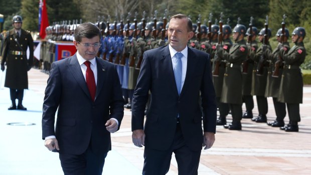 Turkish Prime Minister Ahmet Davutoglu and Australian Prime Minister Tony Abbott at the Cankaya Palace in Ankara.