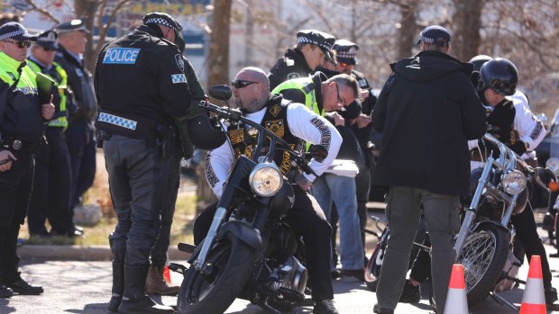 Police monitor the movements of the Commanchero bikies in Canberra last month.