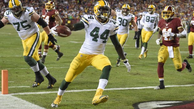 Scoring time: Green Bay Packers running back James Starks carries the ball into the end zone against Washington.