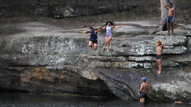Kids cool off at Parramatta Lake, as temperatures in the city's west climbed to almost 40 degrees.