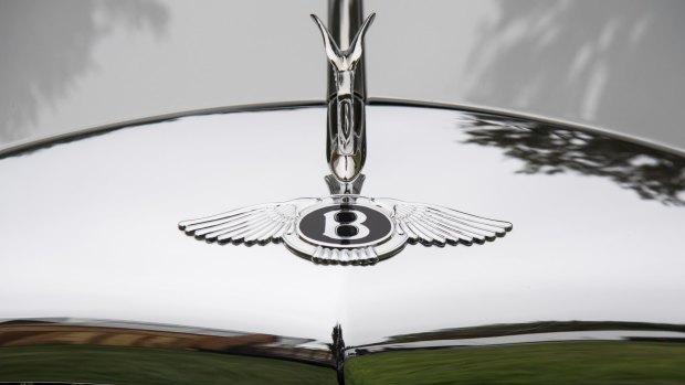 The hood ornament of a restored 1958 Bentley.