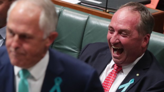 Deputy Prime Minister Barnaby Joyce laughs as Prime Minister Malcolm Turnbull attacks Opposition Leader Bill Shorten.