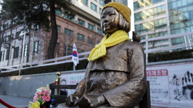 A statue of a girl symbolising the issue of "comfort women" in front of the Japanese Embassy on in Seoul, South Korea. 