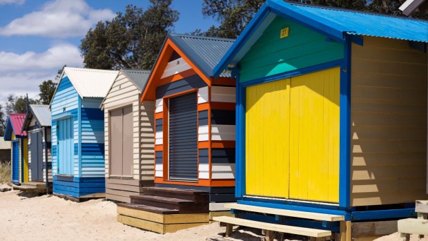 Rainbow-coloured bathing boxes at the Mornington Peninsula, which has changed dramatically in the past few decades.