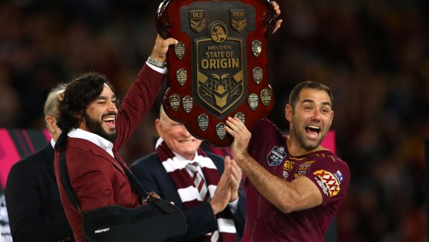 Just too good - again: Johnathan Thurston and Cameron Smith hold aloft the Origin trophy.