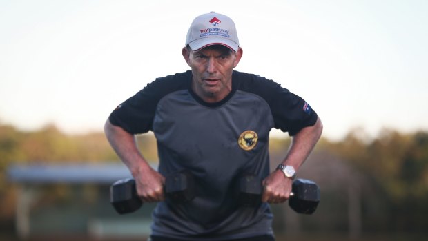 Prime Minister Tony Abbott doing physical training with members of the Bamaga community, during his visit to Cape York.