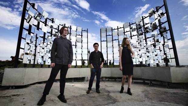 Matthew Asimakis, Clarence Lee and Caitlin Roseby with their sculpture 'Half Gate'.