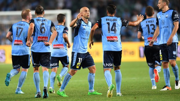 Chalk up another one: Adrian Mierzejewski (centre) and Sydney FC celebrate on Friday night.