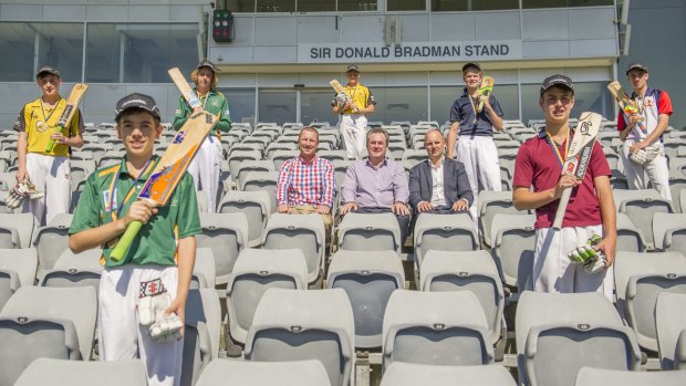 Brad Haddin presented seven ACT centurions with medals on Monday, and Owen Levings, front left, made the former Australian vice-captain jealous.
