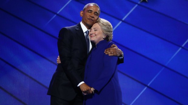 US President Barack Obama hugs Democratic presidential nominee Hillary Clinton during the Democratic National Convention.